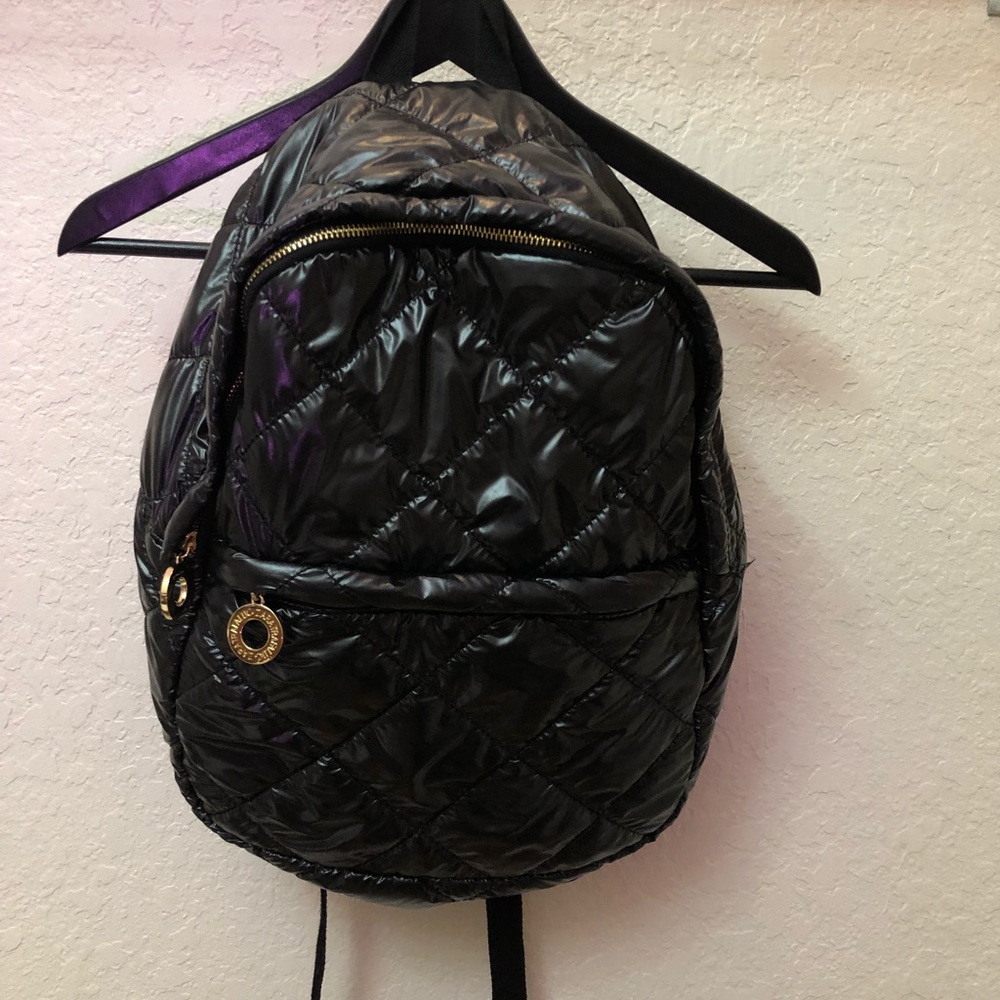 Black and gold puffy backpack